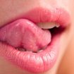 licking lips on clitoral simulant